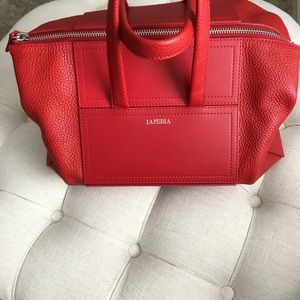 La Perla calfskin daily bag in red.